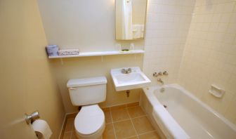 Guest bathroom with tub at Alexandra Hotel.