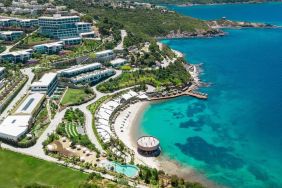 Hotel exterior and ocean view at Le Méridien Bodrum Beach Resort.