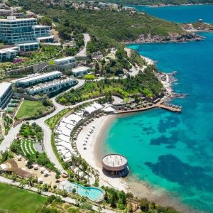 Hotel exterior and ocean view at Le Méridien Bodrum Beach Resort.