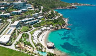 Hotel exterior and ocean view at Le Méridien Bodrum Beach Resort.