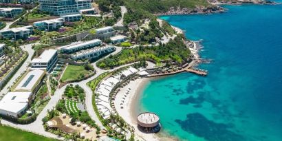 Hotel exterior and ocean view at Le Méridien Bodrum Beach Resort.