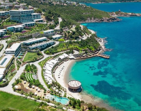 Hotel exterior and ocean view at Le Méridien Bodrum Beach Resort.