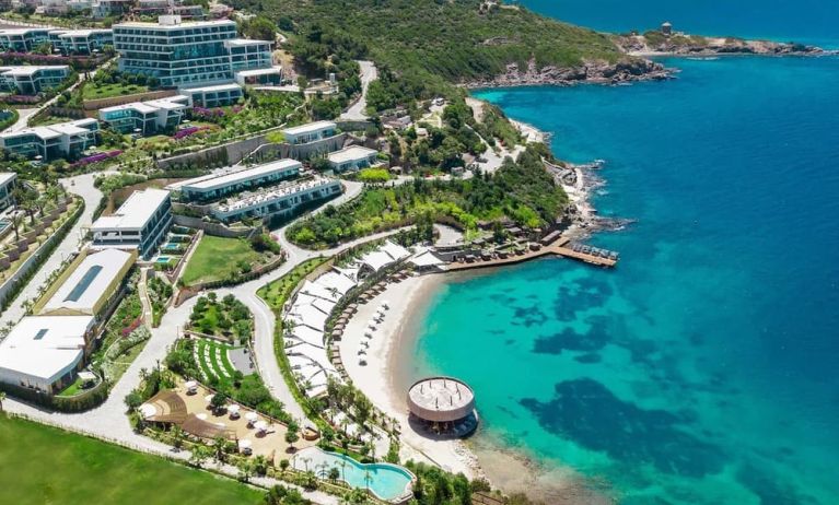 Hotel exterior and ocean view at Le Méridien Bodrum Beach Resort.