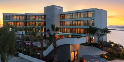 Hotel exterior at sunset at Le Méridien Bodrum Beach Resort.