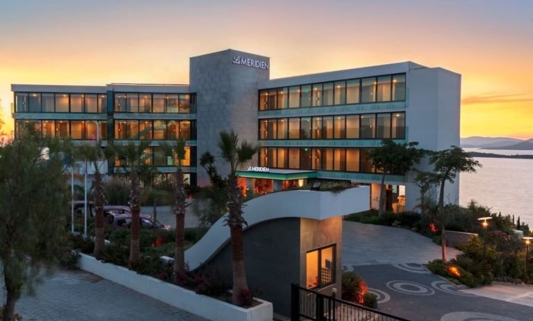 Hotel exterior at sunset at Le Méridien Bodrum Beach Resort.