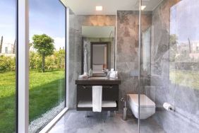 Guest bathroom with shower at Le Méridien Bodrum Beach Resort.