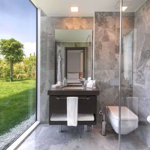 Guest bathroom with shower at Le Méridien Bodrum Beach Resort.