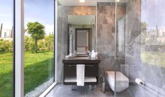 Guest bathroom with shower at Le Méridien Bodrum Beach Resort.