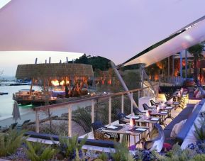 Terrace and outdoor seating at Le Méridien Bodrum Beach Resort.