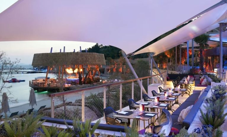 Terrace and outdoor seating at Le Méridien Bodrum Beach Resort.