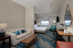 Spacious king room with lounge area at Four Points By Sheraton Fort Lauderdale Airport - Dania Beach.