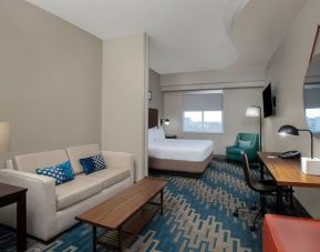 Spacious king room with lounge area at Four Points By Sheraton Fort Lauderdale Airport - Dania Beach.