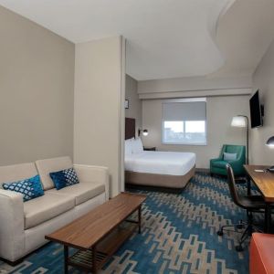 Spacious king room with lounge area at Four Points By Sheraton Fort Lauderdale Airport - Dania Beach.