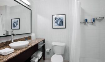 Guest bathroom with shower at Four Points By Sheraton Fort Lauderdale Airport - Dania Beach.