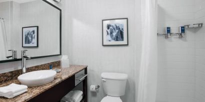 Guest bathroom with shower at Four Points By Sheraton Fort Lauderdale Airport - Dania Beach.