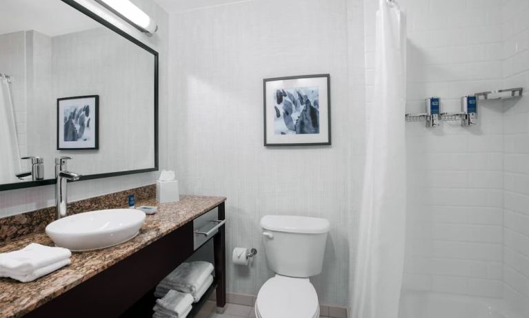 Guest bathroom with shower at Four Points By Sheraton Fort Lauderdale Airport - Dania Beach.