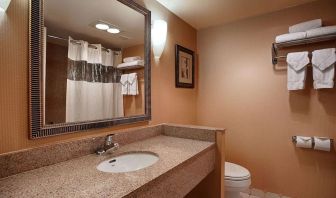 Private guest bathroom with shower at Best Western Plus Hotel & Conference Center.