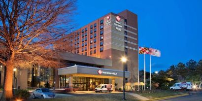 Hotel exterior at night at Best Western Plus Hotel & Conference Center.