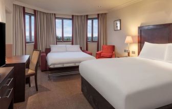 Day use room with TV and extra bed at DoubleTree By Hilton Glasgow Westerwood.