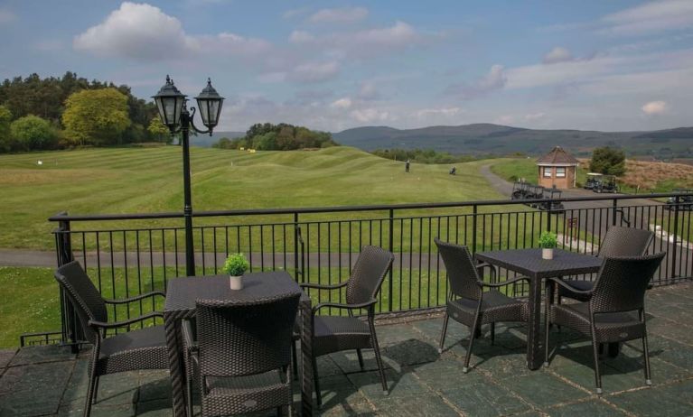 Outdoor terrace overlooking golf course at DoubleTree By Hilton Glasgow Westerwood.