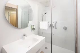 Guest bathroom with shower at Hampton By Hilton London Old Street.