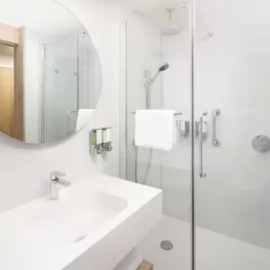 Guest bathroom with shower at Hampton By Hilton London Old Street.