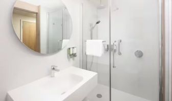 Guest bathroom with shower at Hampton By Hilton London Old Street.