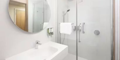 Guest bathroom with shower at Hampton By Hilton London Old Street.