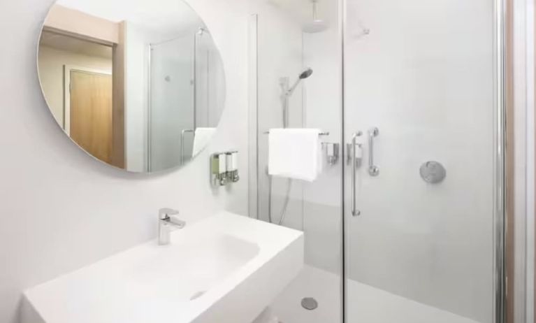 Guest bathroom with shower at Hampton By Hilton London Old Street.