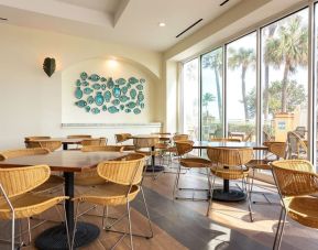 Dining and coworking space at Embassy Suites By Hilton Deerfield Beach Resort & Spa.