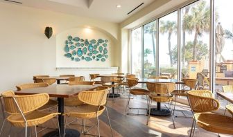 Dining and coworking space at Embassy Suites By Hilton Deerfield Beach Resort & Spa.