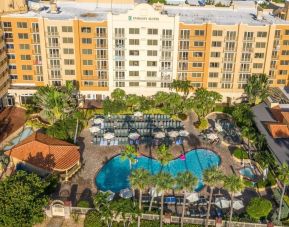 Hotel with large outdoor pool at Embassy Suites By Hilton Deerfield Beach Resort & Spa.