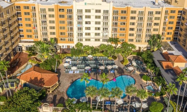 Hotel with large outdoor pool at Embassy Suites By Hilton Deerfield Beach Resort & Spa.