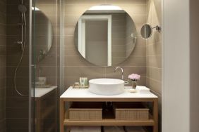 Guest bathroom with shower at Mendeli Street Hotel.