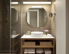 Guest bathroom with shower at Mendeli Street Hotel.