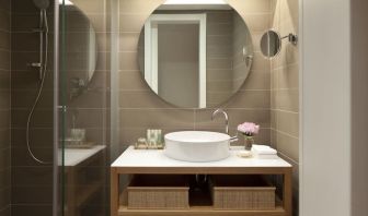 Guest bathroom with shower at Mendeli Street Hotel.