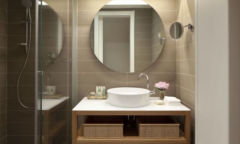 Guest bathroom with shower at Mendeli Street Hotel.