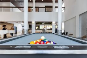 Game room and pool table at Regency Miami Airport By Sonesta.