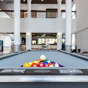 Game room and pool table at Regency Miami Airport By Sonesta.