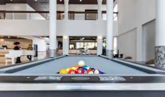 Game room and pool table at Regency Miami Airport By Sonesta.