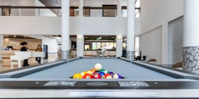 Game room and pool table at Regency Miami Airport By Sonesta.