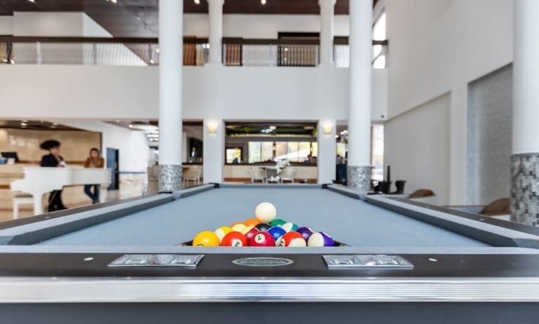 Game room and pool table at Regency Miami Airport By Sonesta.