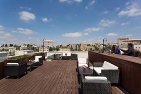 Rooftop terrace and chairs at Prima Royale Hotel.