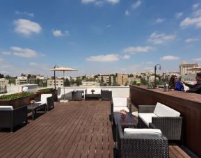 Rooftop terrace and chairs at Prima Royale Hotel.