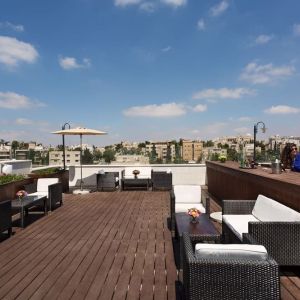 Rooftop terrace and chairs at Prima Royale Hotel.