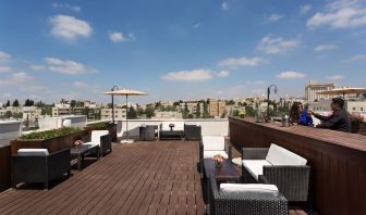 Rooftop terrace and chairs at Prima Royale Hotel.