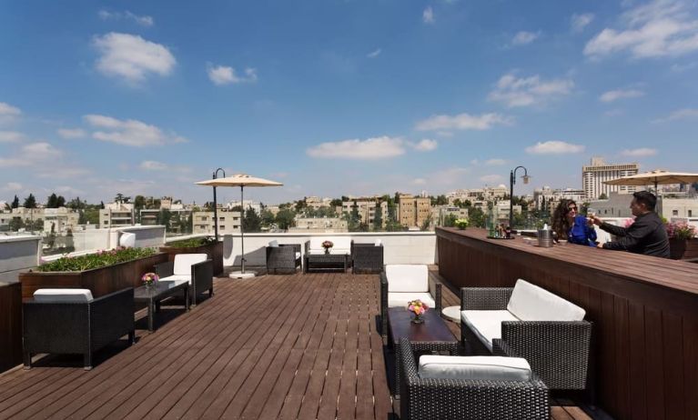 Rooftop terrace and chairs at Prima Royale Hotel.