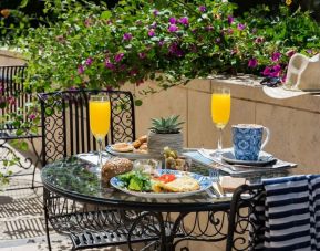 Breakfast available on outdoor terrace at Prima Royale Hotel.