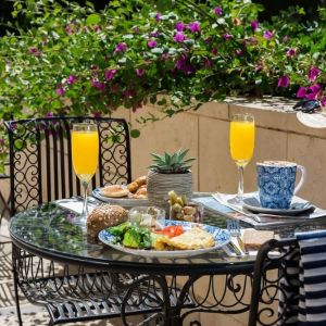 Breakfast available on outdoor terrace at Prima Royale Hotel.