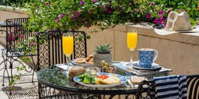 Breakfast available on outdoor terrace at Prima Royale Hotel.